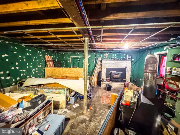 a view of a patio with a table and chairs under an umbrella