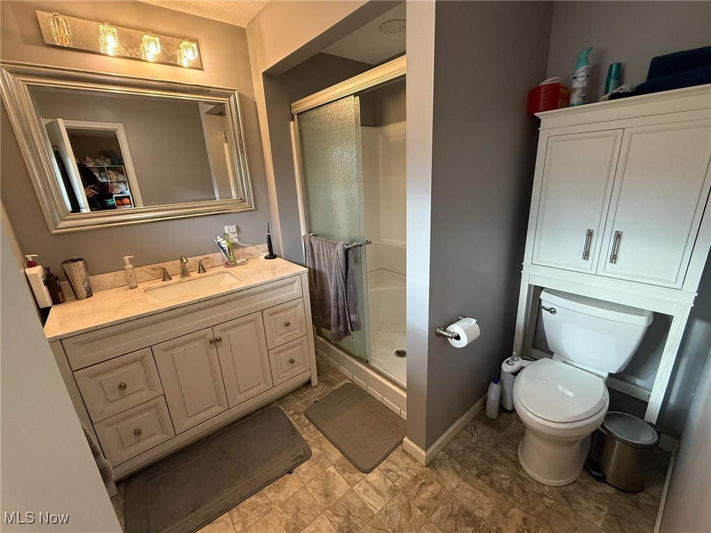 10719 Johnnycake Ridge Road Painesville, OH 44077 - Photo 11 of 21 Full bath with a shower stall and vanity