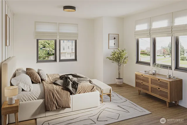 a living room with furniture and large windows