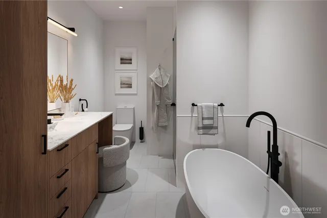 a bathroom with a bathtub sink and mirror