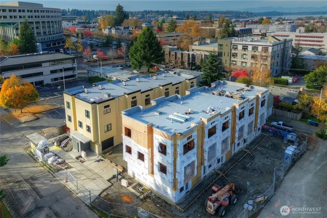 a view of a buildings with sitting area and furniture