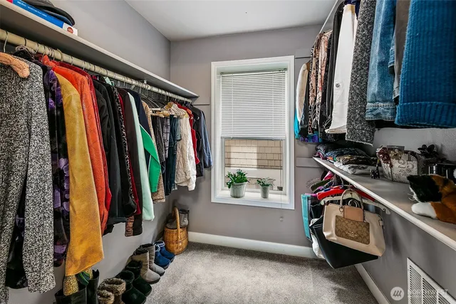 a kitchen with granite countertop a sink stove and cabinets