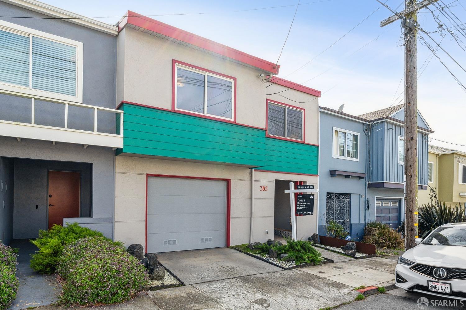 385 Mangels Avenue San Francisco, CA 94127 - Photo 1 of 39 a front view of a house with a garden and plants