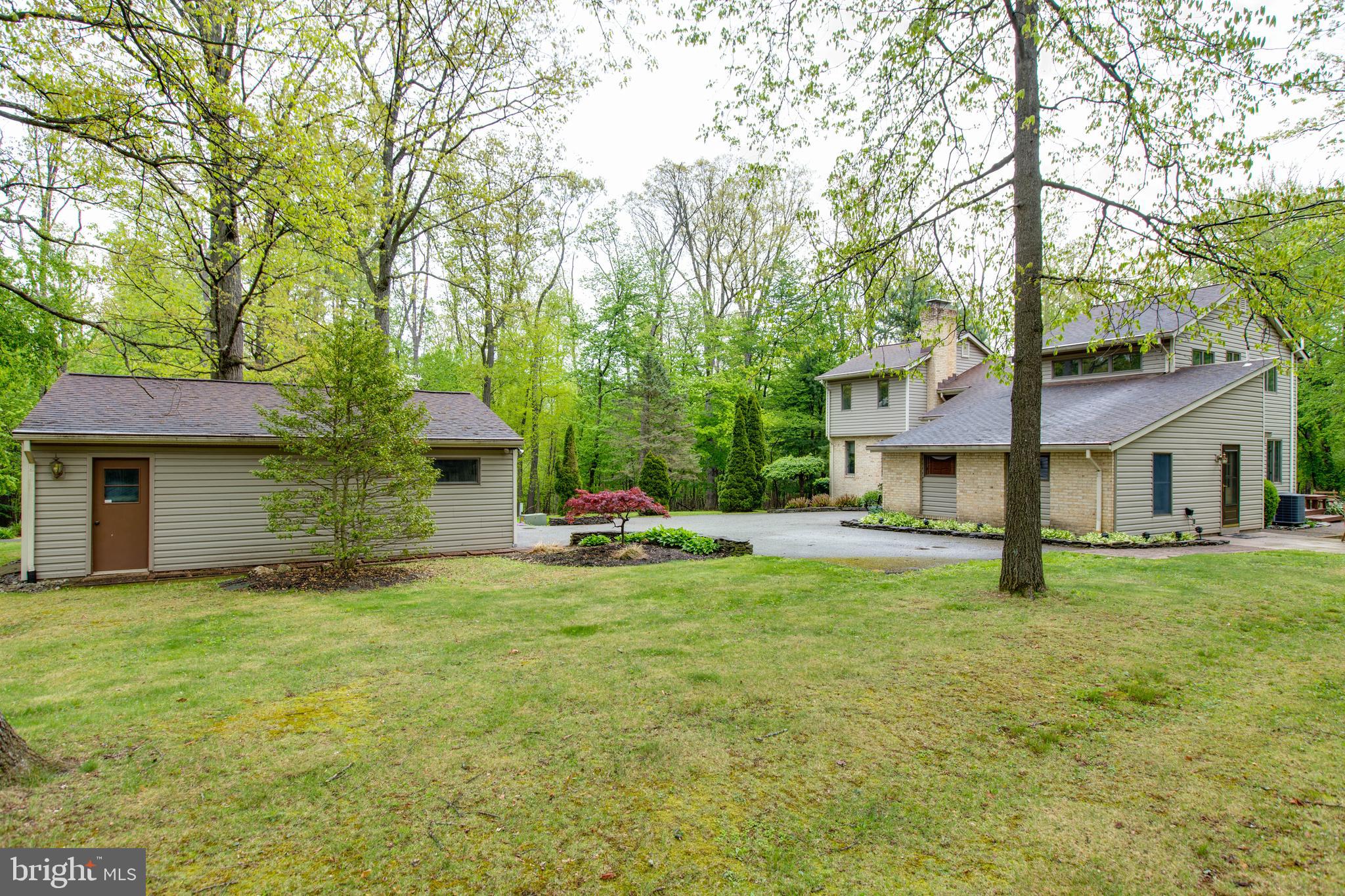 5519 Woodbine Road Sykesville, MD 21784 - Photo 59 of 69 a view of a house with a yard and sitting area