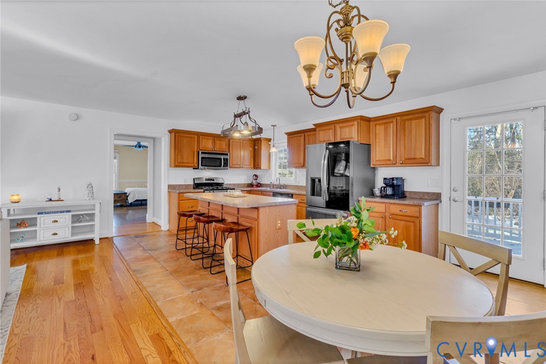 43 Ruddy Duck Road Heathsville, VA 22473 - Photo 11 of 46 a kitchen with stainless steel appliances granite countertop a stove a sink and a dining table