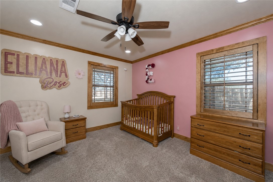 2302 Quail Run College Station, TX 77845 - Photo 16 of 49 a bedroom with furniture and a window