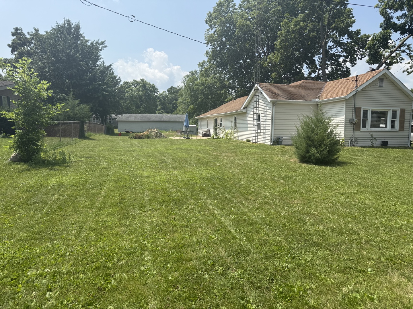 126 8th Street Hennepin, IL 61327 - Photo 17 of 17 a front view of a house with yard and green space