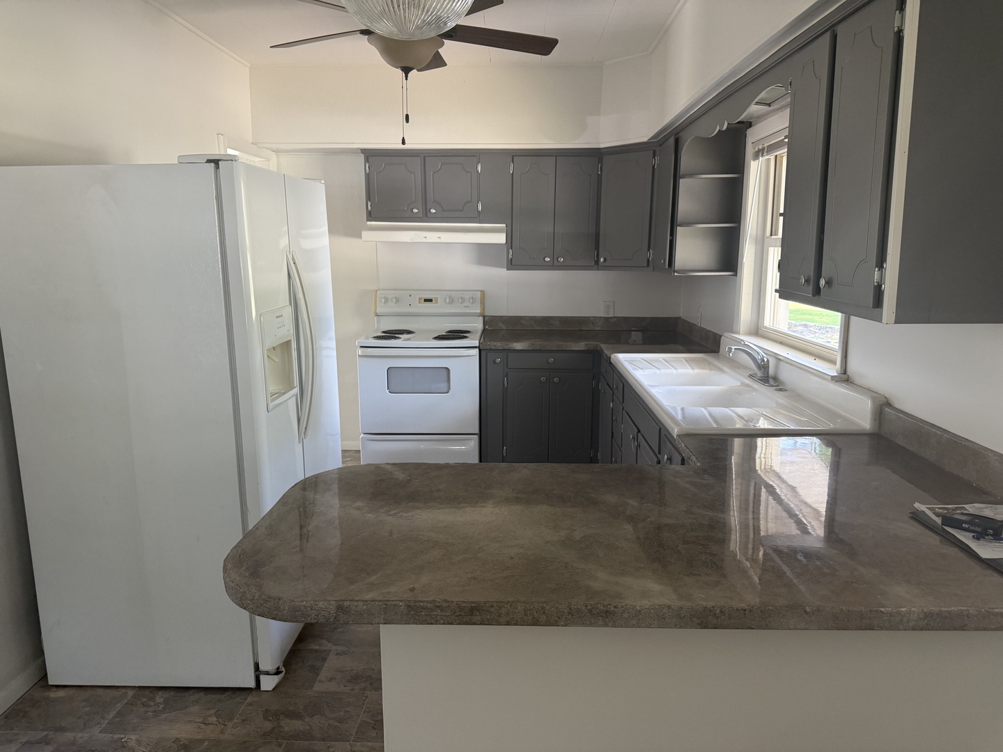 126 8th Street Hennepin, IL 61327 - Photo 2 of 17 a kitchen with stainless steel appliances granite countertop a sink stove and refrigerator