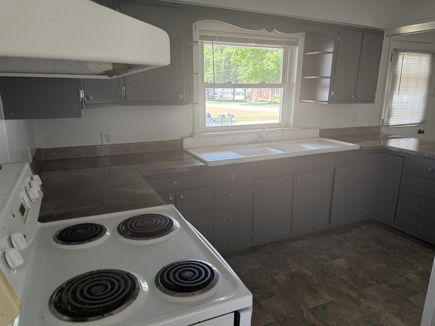 126 8th Street Hennepin, IL 61327 - Photo 3 of 17 a kitchen with a stove and a microwave