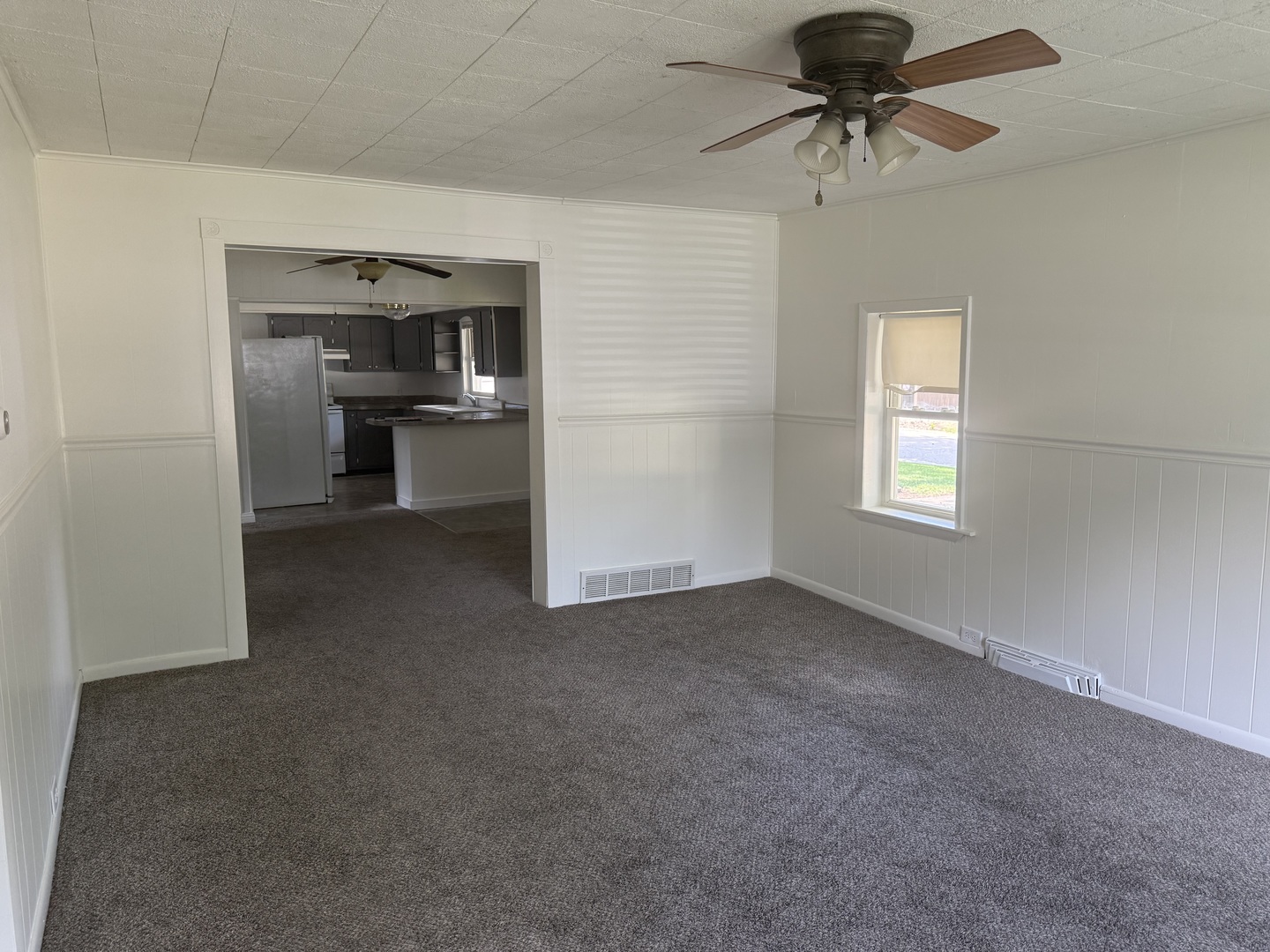 126 8th Street Hennepin, IL 61327 - Photo 6 of 17 an empty room with windows and cabinet