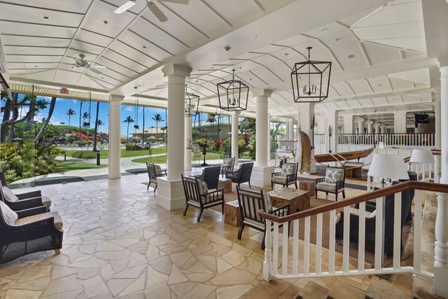 a view of a porch with furniture and garden