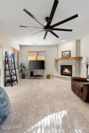 a bed room with furniture and a flat screen tv