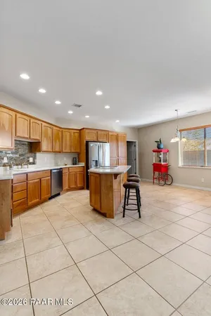 a dining room with furniture and a chandelier