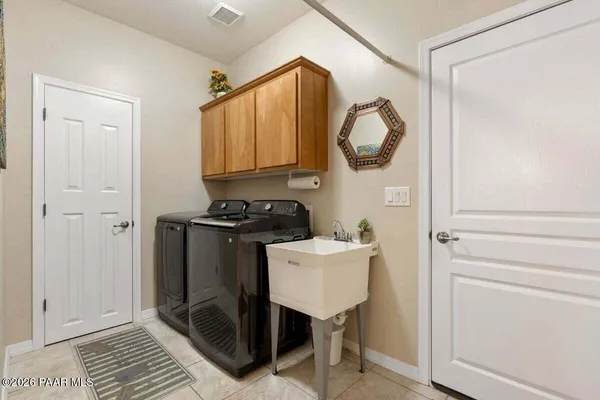 a bedroom with a bed and glass window