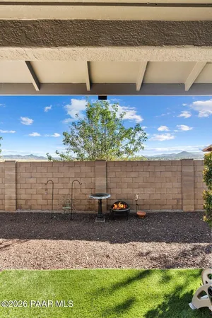 a house view with a sitting space and garden