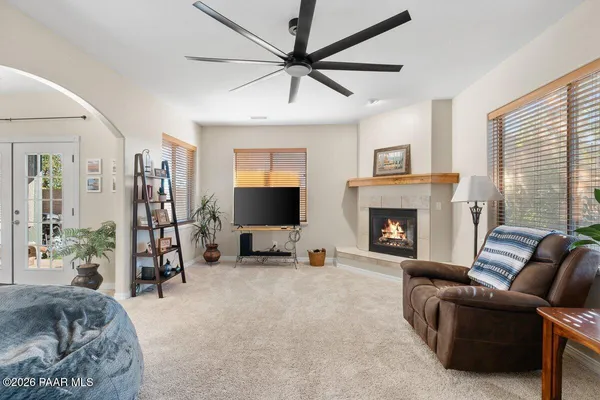 a living room with furniture and a large window