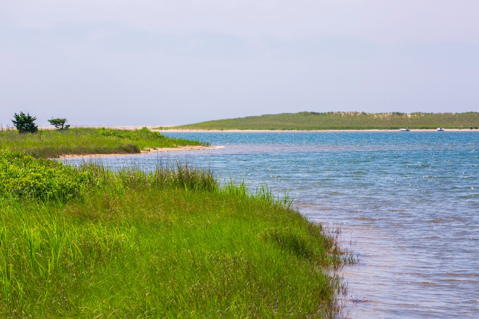 50 Oyster Watcha Road Edgartown, MA 02539 - Photo 13 of 44 a view of a lake with a big yard