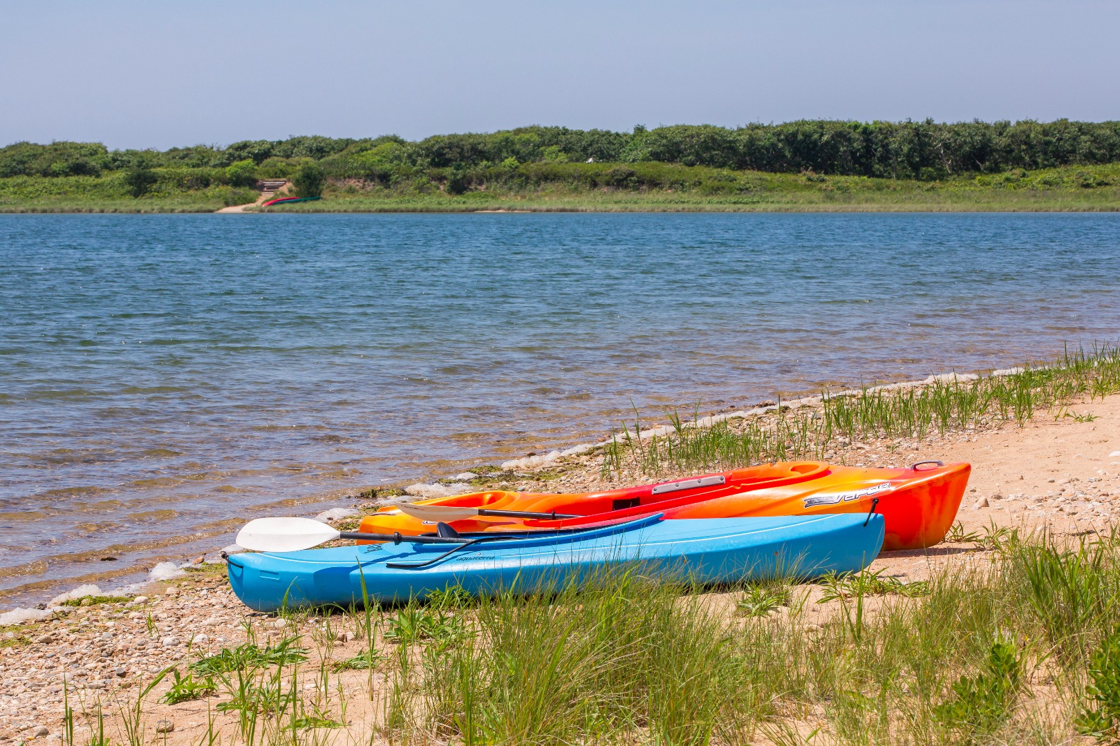 50 Oyster Watcha Road Edgartown, MA 02539 - Photo 14 of 44 a view of lake with lawn chairs and swimming pool