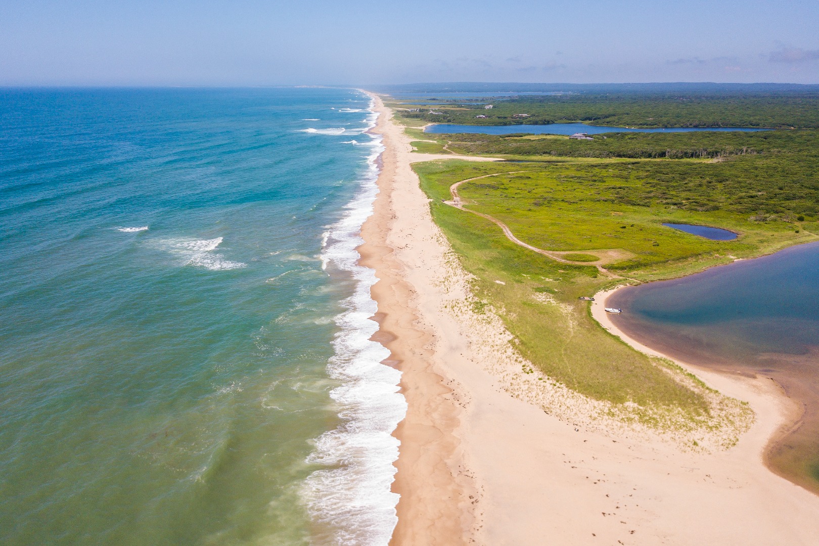 50 Oyster Watcha Road Edgartown, MA 02539 - Photo 7 of 44 a view of a swimming pool with an ocean view