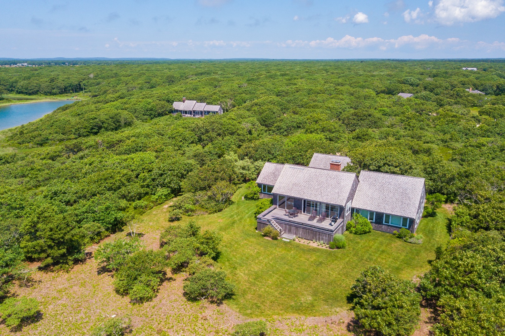 50 Oyster Watcha Road Edgartown, MA 02539 - Photo 9 of 44 a aerial view of a house with garden space and a lake view