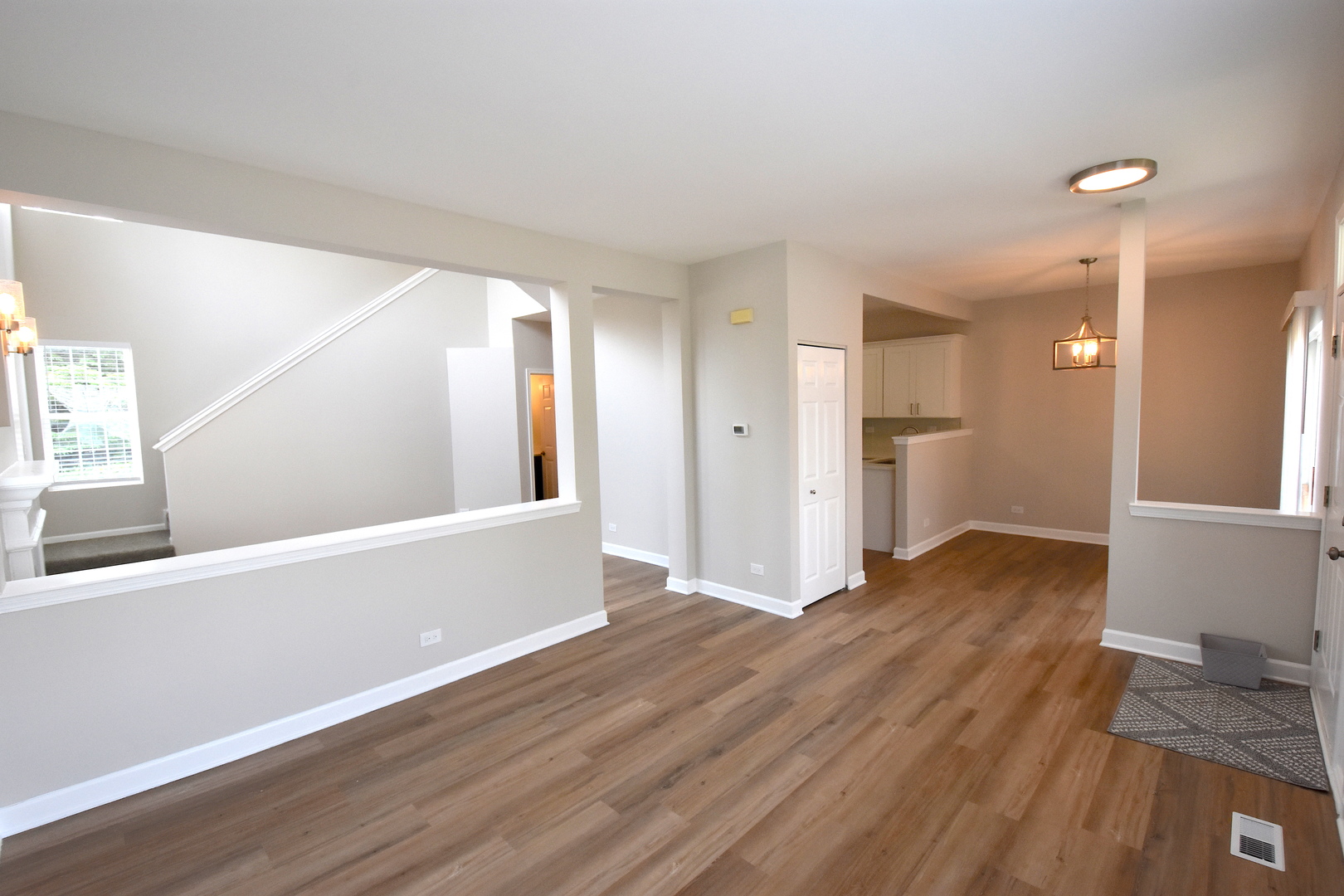 2341 Reflections Drive Aurora, IL 60502 - Photo 11 of 21 a view of a big room with wooden floor and windows