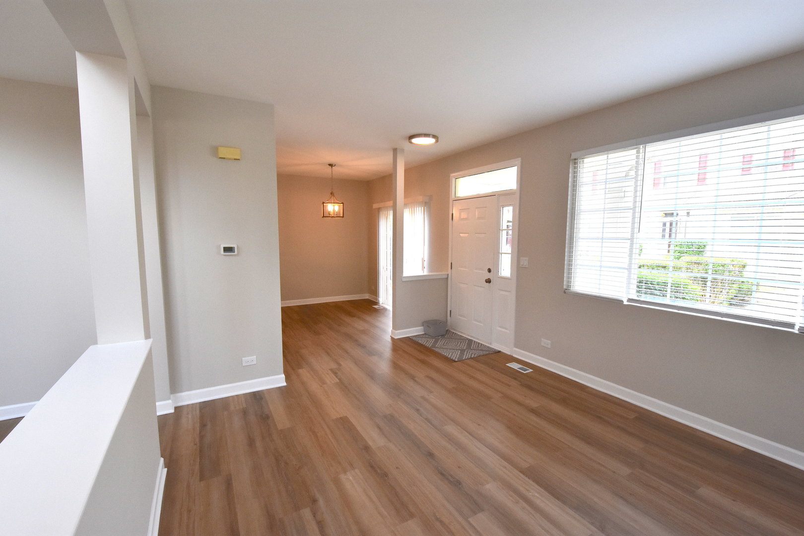 2341 Reflections Drive Aurora, IL 60502 - Photo 12 of 21 a view of a room with wooden floor and windows