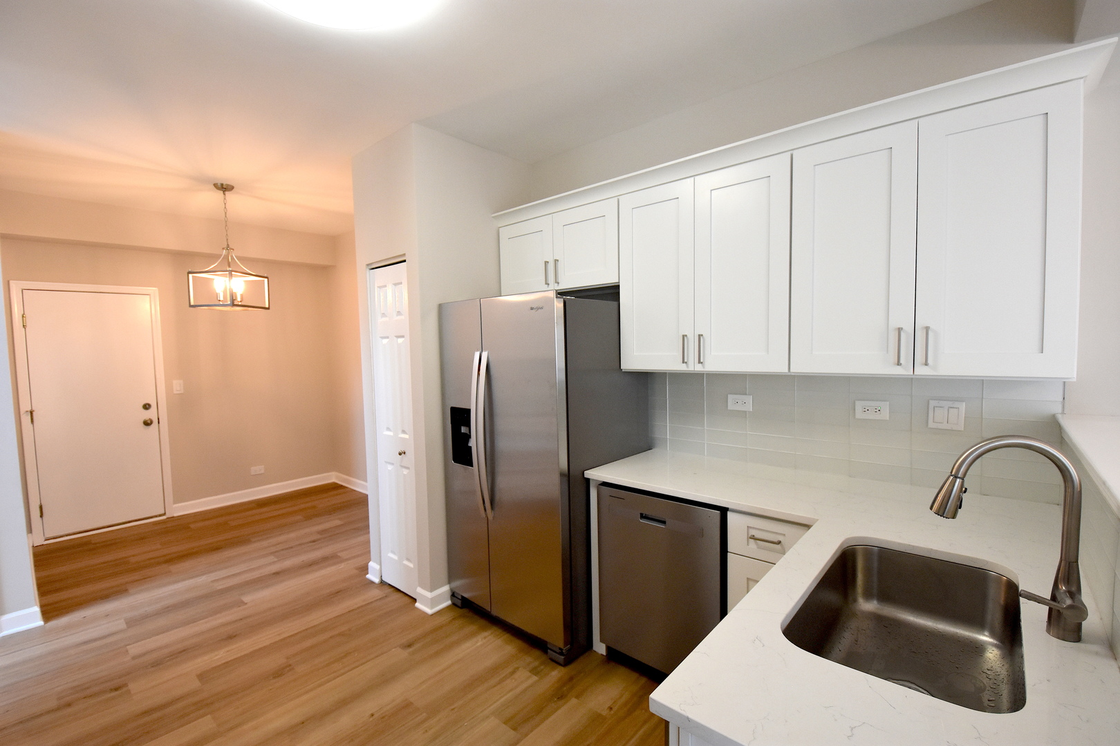 2341 Reflections Drive Aurora, IL 60502 - Photo 6 of 21 a kitchen with a sink a refrigerator and cabinets