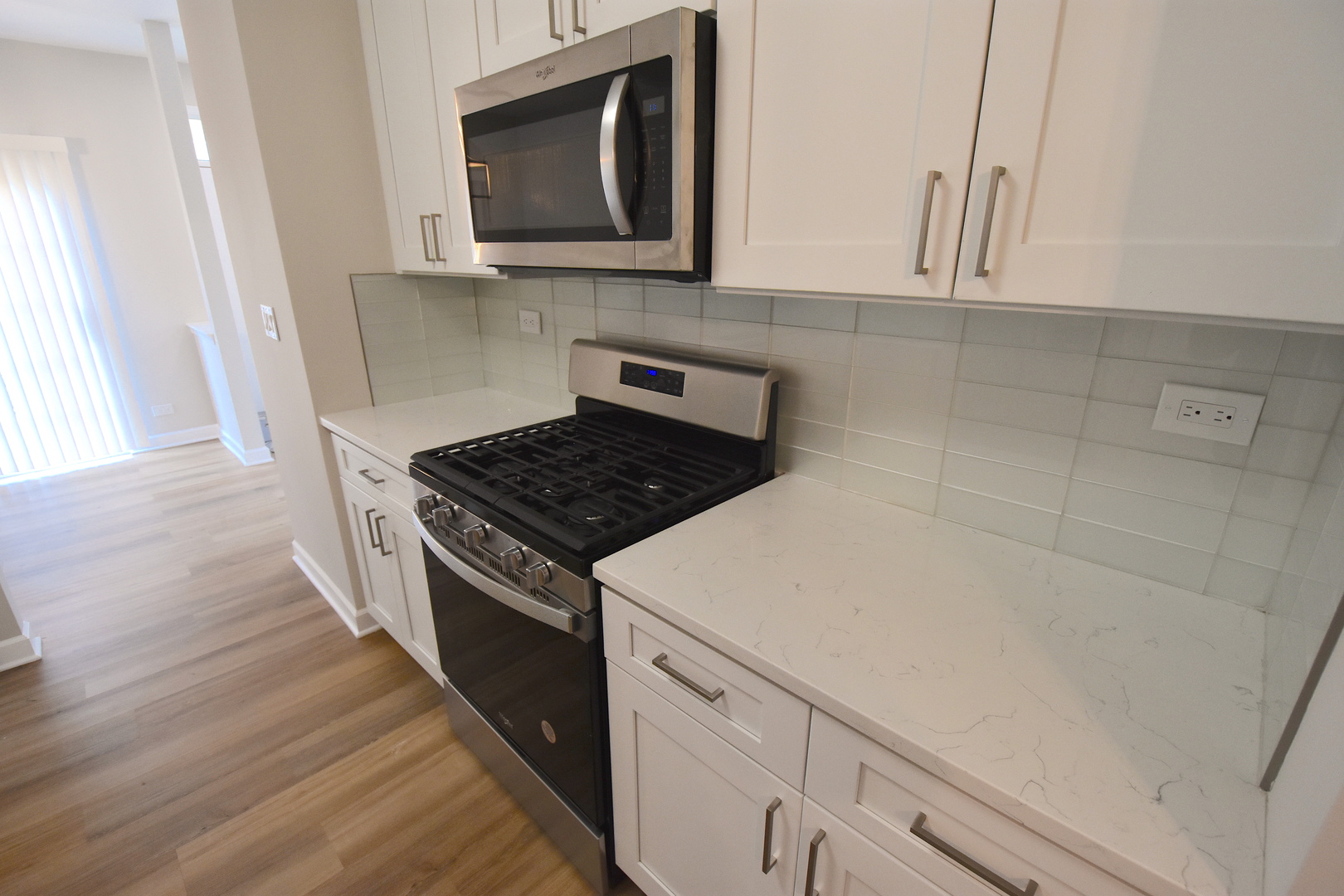 2341 Reflections Drive Aurora, IL 60502 - Photo 8 of 21 a kitchen with a stove microwave and sink