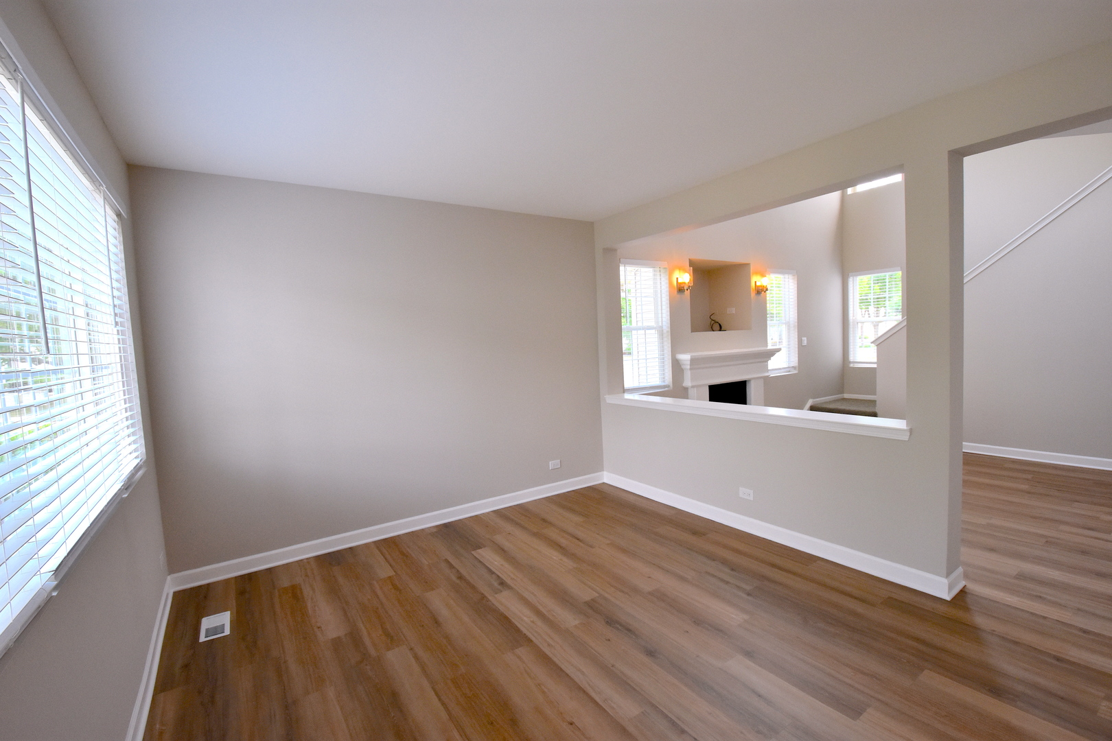 2341 Reflections Drive Aurora, IL 60502 - Photo 9 of 21 wooden floor in an empty room with a window