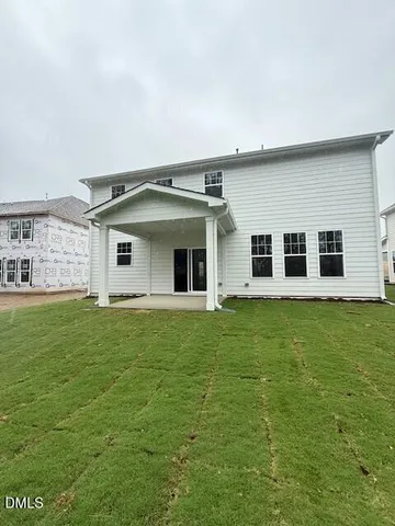 a house view with a garden space