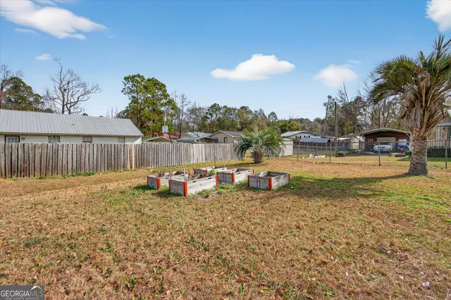 a view of a swimming pool with an outdoor seating and house in the background