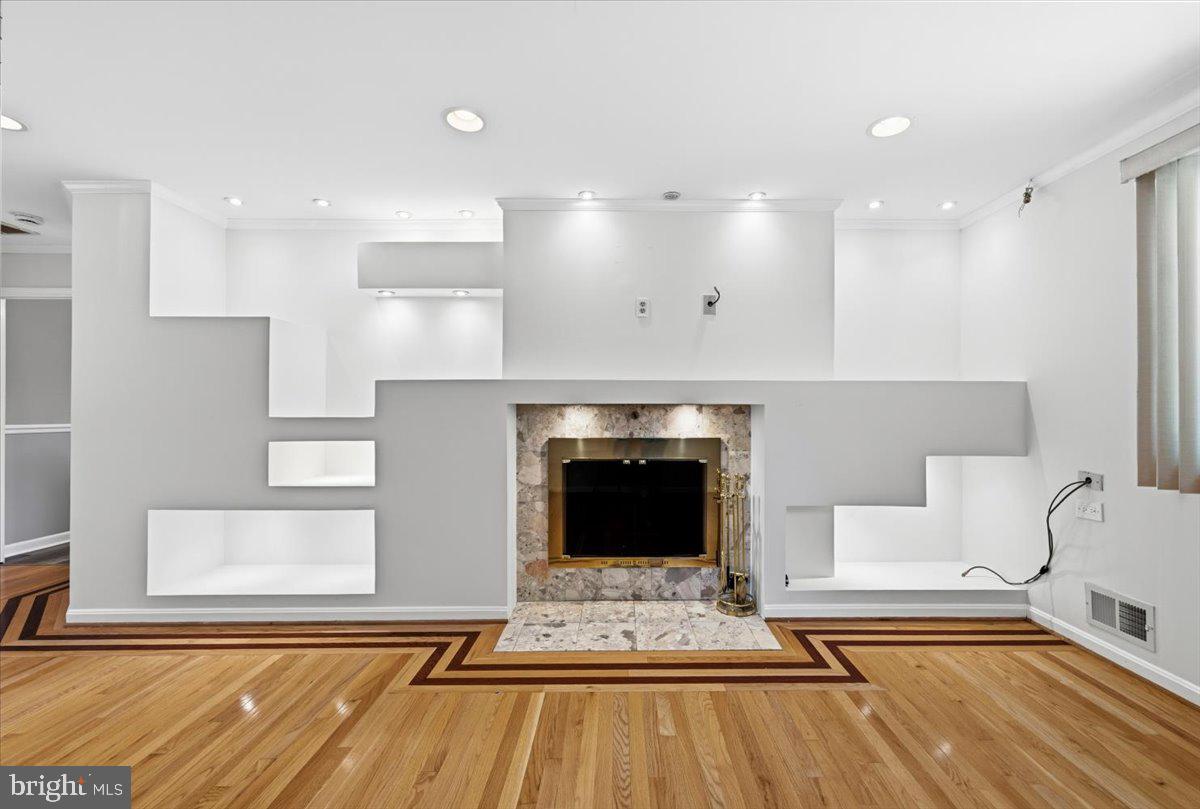 5804 Spell Road Clinton, MD 20735 - Photo 3 of 58 Family Room with fireplace and lighted built-ins !