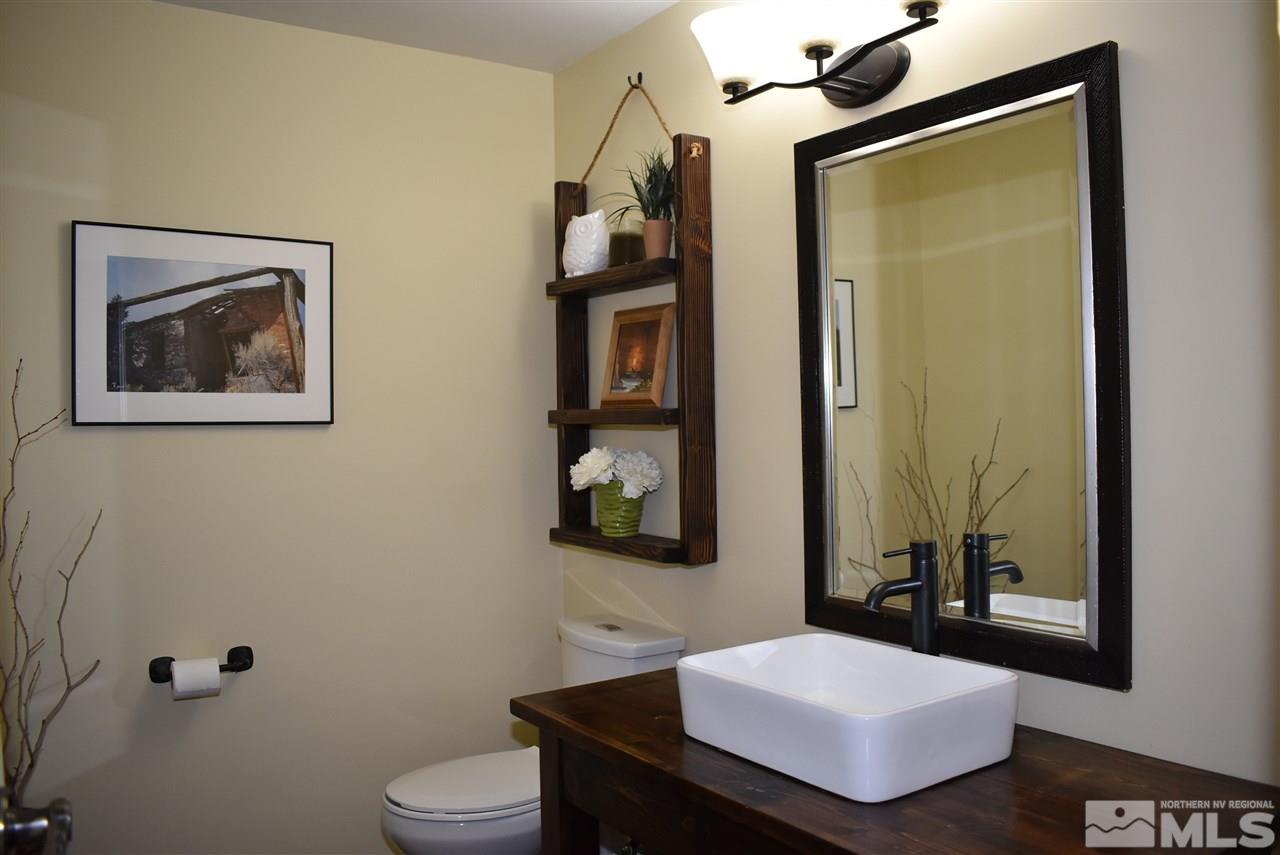 1880 Sharon Way Reno, NV 89509 - Photo 13 of 25 a bathroom with a toilet sink and mirror