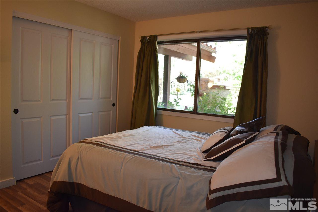 1880 Sharon Way Reno, NV 89509 - Photo 14 of 25 a bedroom with a bed and a window