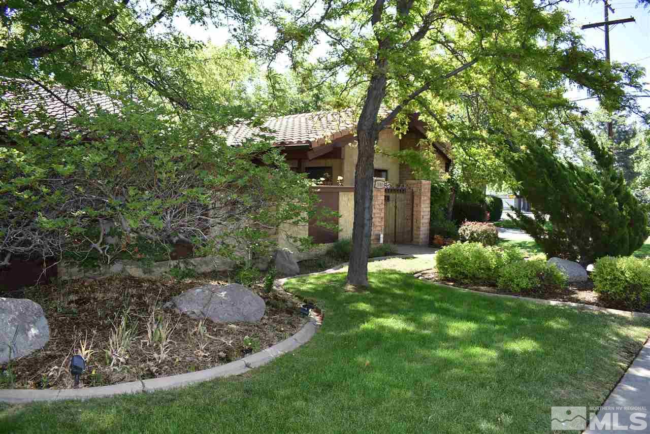 1880 Sharon Way Reno, NV 89509 - Photo 2 of 25 a backyard of a house with yard and outdoor seating