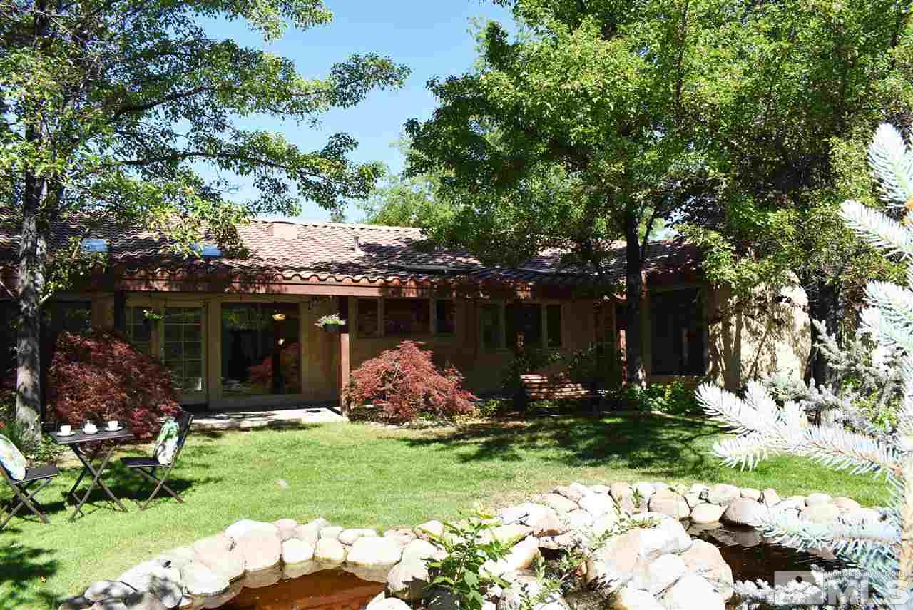 1880 Sharon Way Reno, NV 89509 - Photo 21 of 25 a view of a house with a yard and potted plants