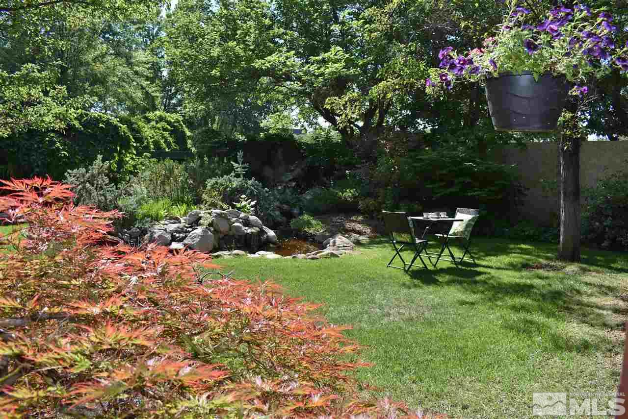 1880 Sharon Way Reno, NV 89509 - Photo 23 of 25 a garden with a bench and some trees