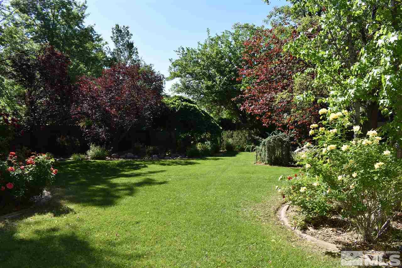 1880 Sharon Way Reno, NV 89509 - Photo 24 of 25 a backyard of a house with lots of green space and garden