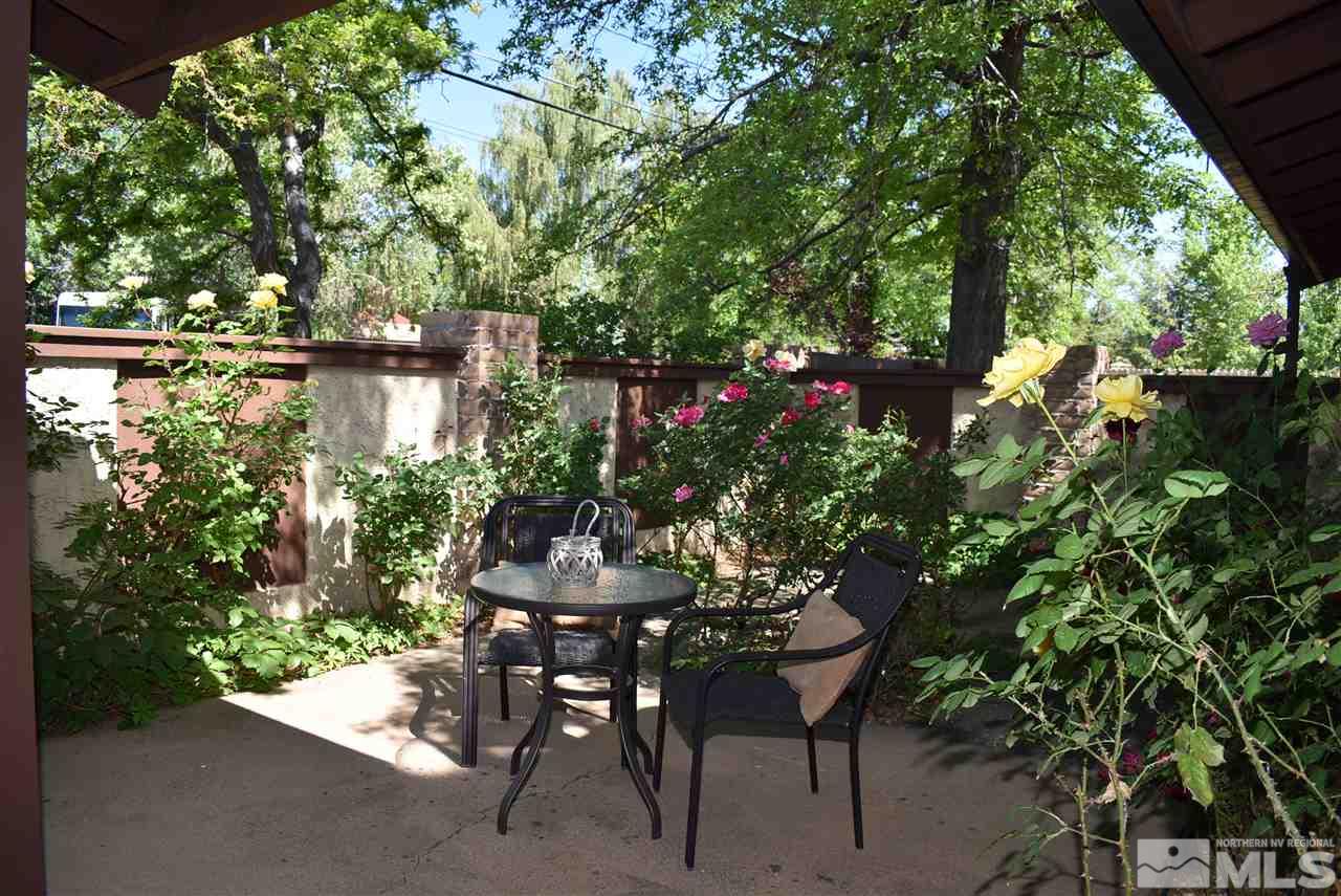 1880 Sharon Way Reno, NV 89509 - Photo 4 of 25 a backyard of a house with a table and chairs