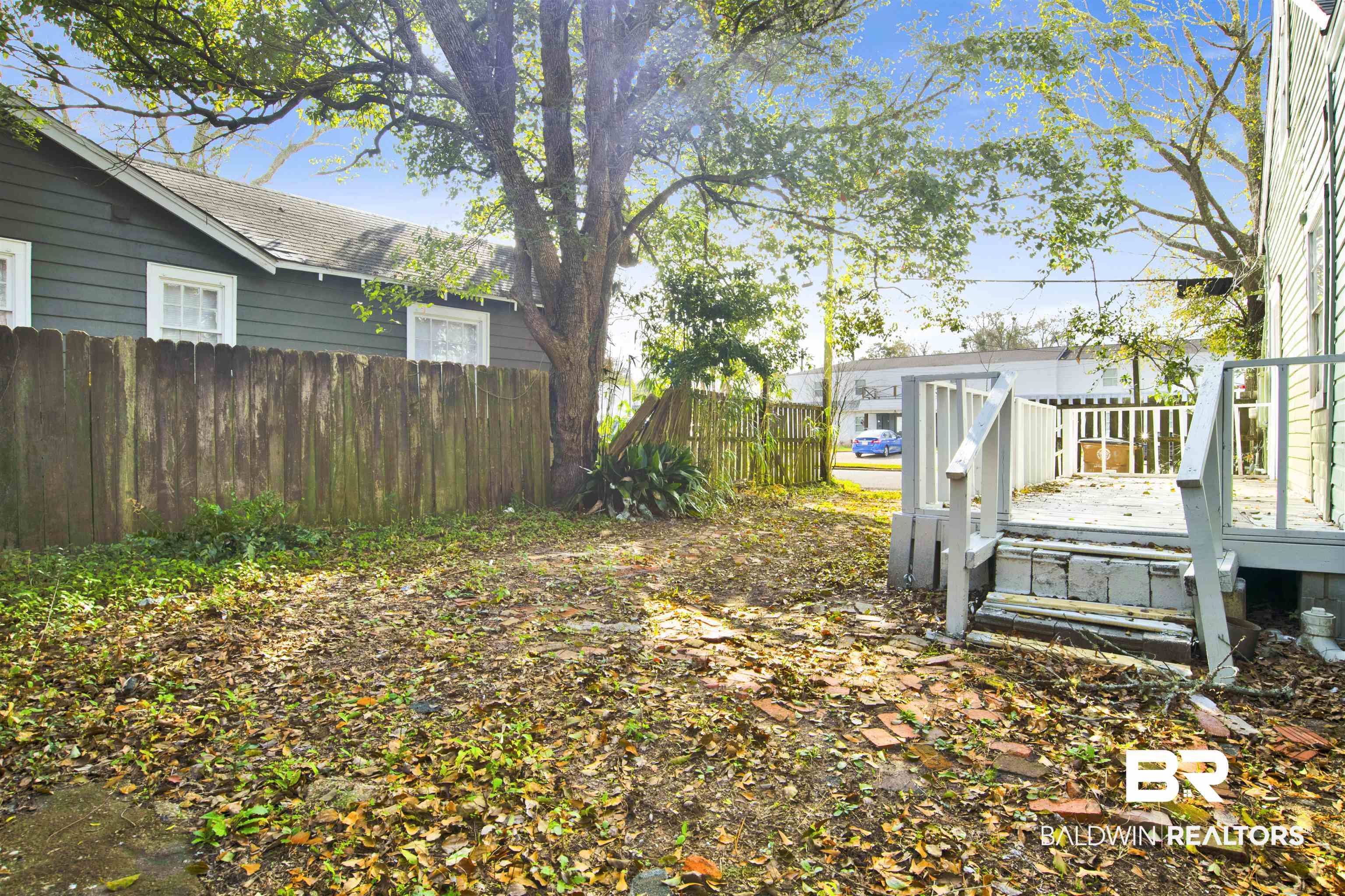 1063 Selma Street Mobile, AL 36604 - Photo 29 of 32 Fenced yard featuring a wooden deck