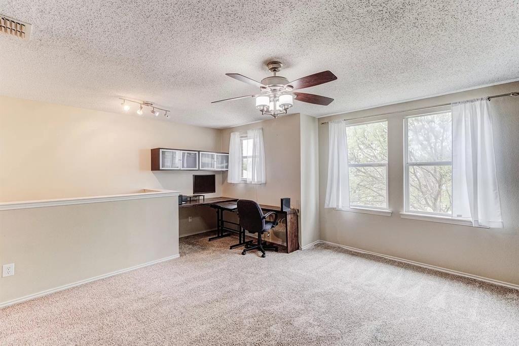 3601 McClintick Road McKinney, TX 75070 - Photo 11 of 24 a view of a workspace with furniture and a window