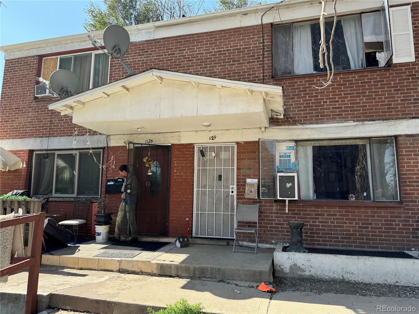 1125 South Raritan Street Denver, CO 80223 - Photo 1 of 1 a view of a house with backyard