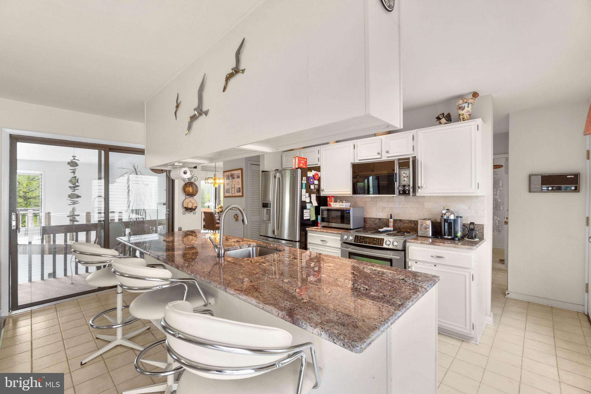 11102 Willow Bottom Drive Columbia, MD 21044 - Photo 38 of 44 Granite counters, stainless steel appliances.