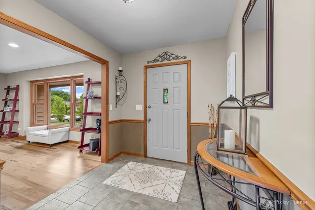 a kitchen with refrigerator and cabinets
