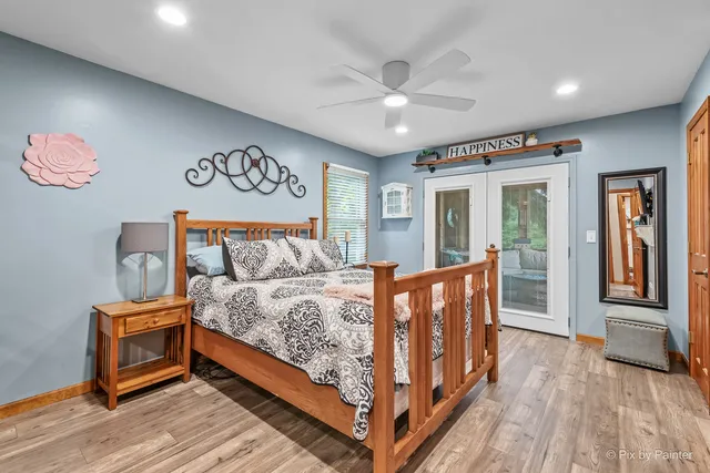 a bedroom with a large bed and a dresser