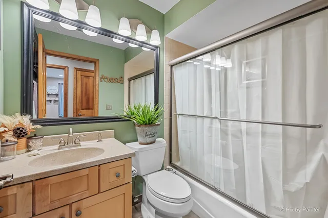 a living room with furniture a table and a chandelier