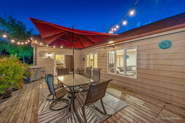 a patio with table and chairs