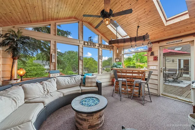 a view of a patio with a table and chairs