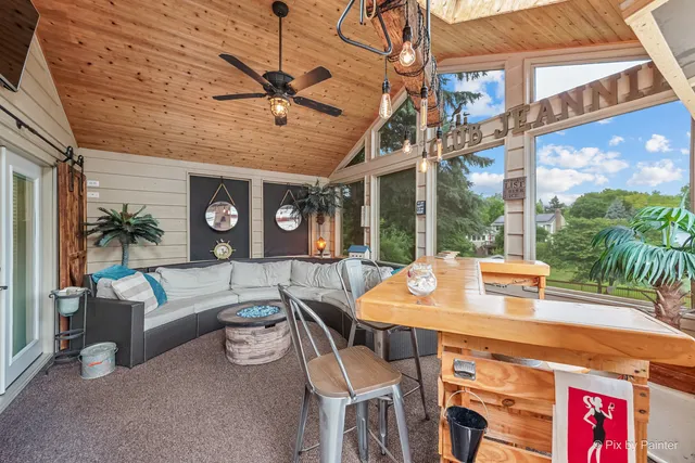 a kitchen with stainless steel appliances granite countertop a stove top oven a sink dishwasher a refrigerator and white cabinets with wooden floor