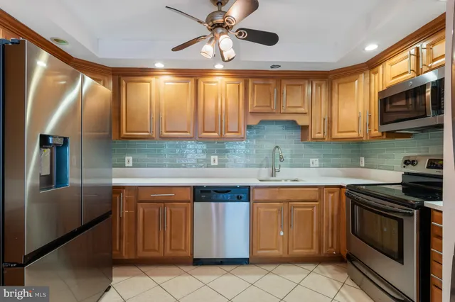a kitchen with a stove and a sink